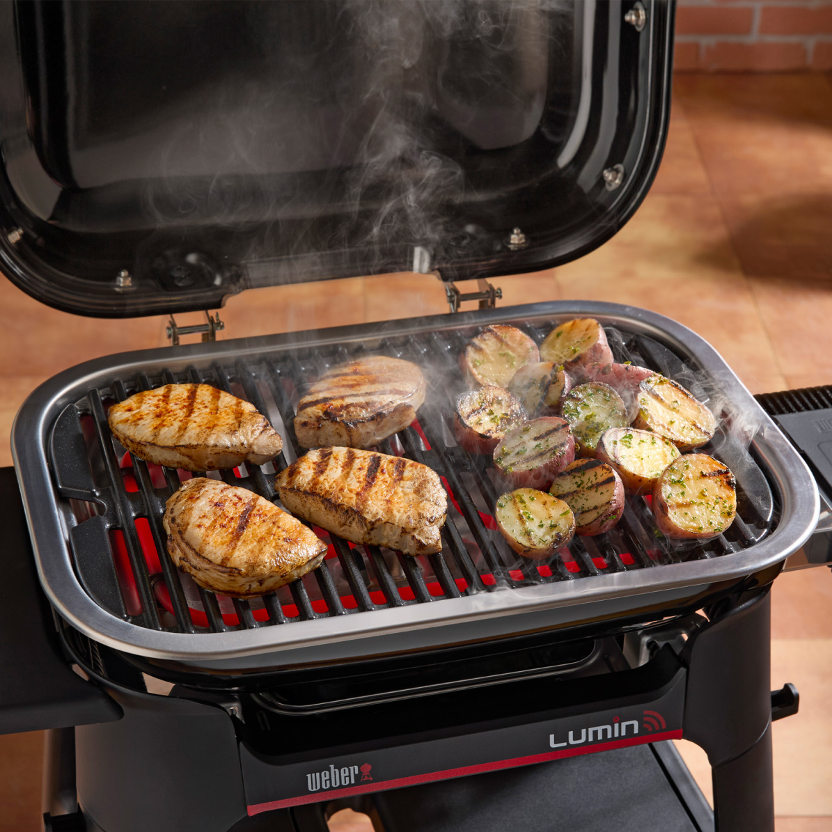 Weber Elektrogrill LUMIN mit Stand + gratis Grillplatte (2026)